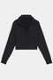 The Joan Fleece Polo Sweatshirt in black by SPLITS59 is a long-sleeve collared crop top made from stretch modal fabric, set against a white background.