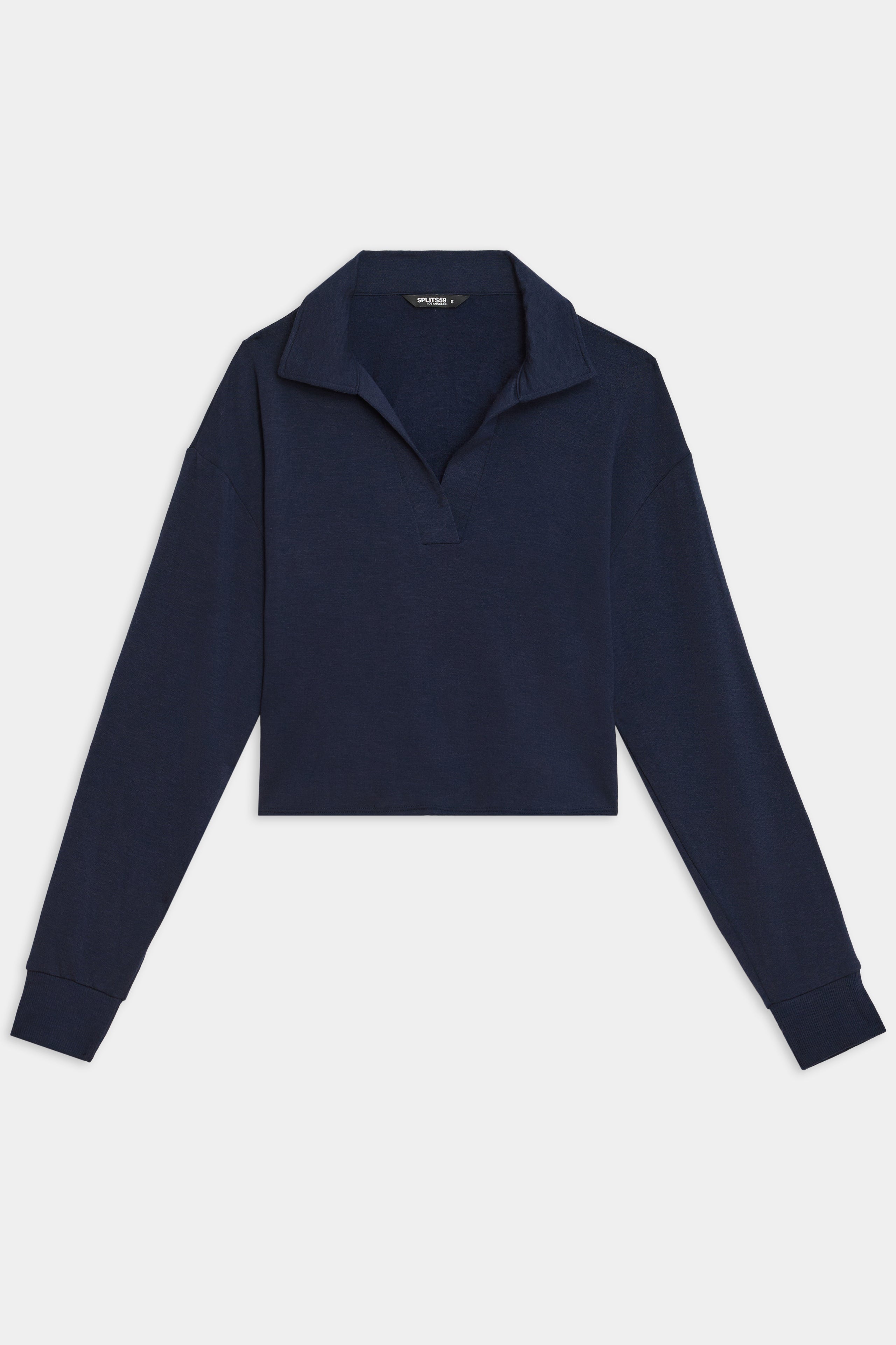 The SPLITS59 Joan Fleece Polo Sweatshirt in indigo features long sleeves, a V-neck, and a spread collar, crafted from stretch modal fabric on a white background.