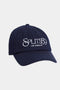 The Tennis Cap in indigo from SPLITS59 showcases "Los Angeles" embroidery in a crisp white on the front.