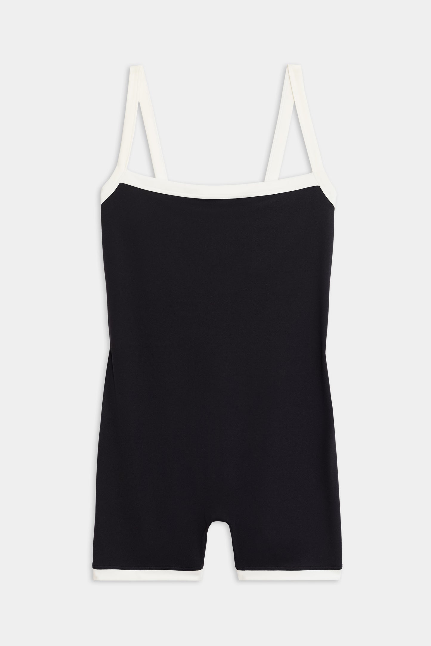 The Monah Rigor Jumpsuit by SPLITS59 is a black one-piece featuring a Monah silhouette with contrasting white straps and trim, crafted from durable Rigor fabric for high-intensity workouts, shown against a plain white background.