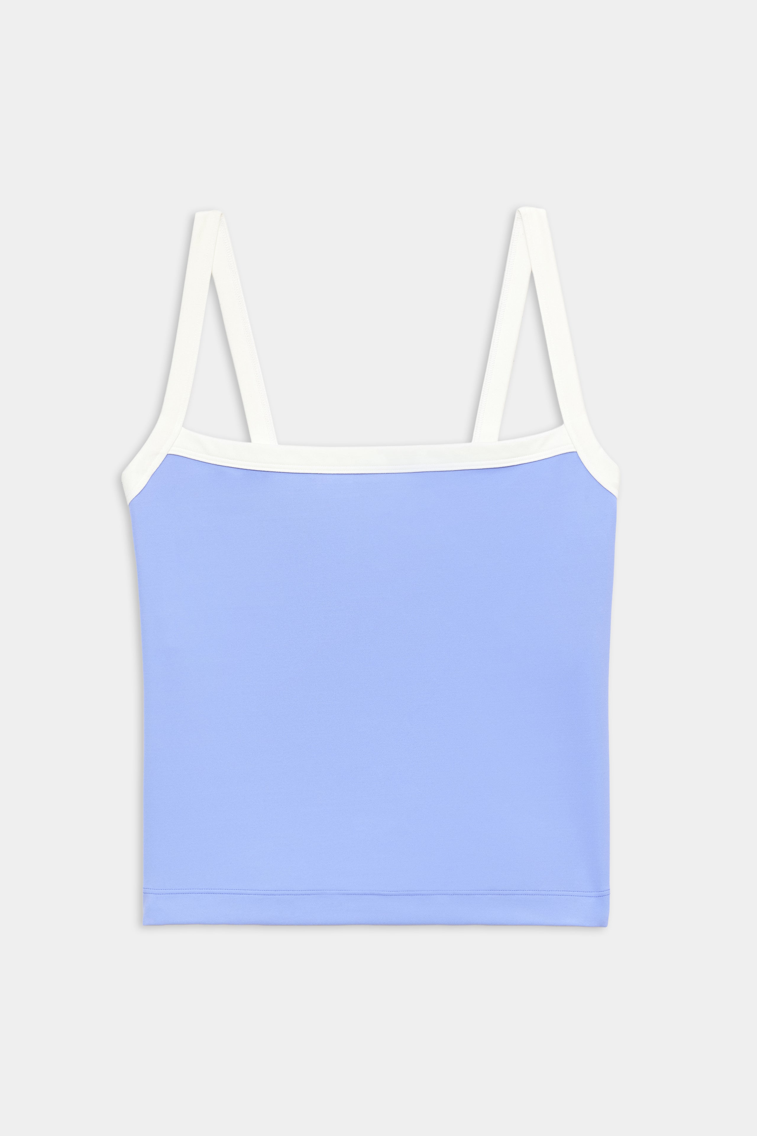 A light blue crop top with white straps and trim, displayed against a plain white background.