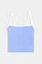 A light blue crop top with white straps and trim, displayed against a plain white background.