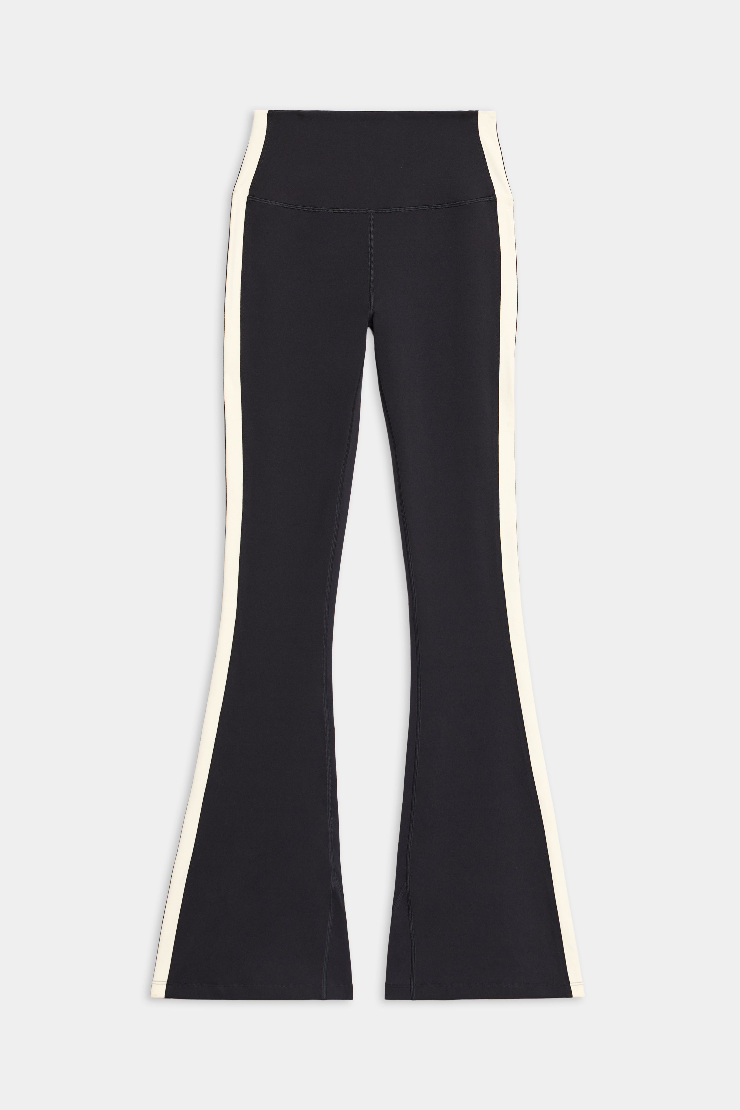 The SPLITS59 Raquel High Waist Flared Legging in Black/Creme, featuring white side stripes and crafted from 4-way stretch fabric, is shown laid flat on a white background.