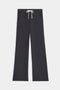 The SPLITS59 Raven Fleece Full Length Sweatpant features a black wide-leg design with an elastic waistband, white drawstring, and side pockets, shown flat on a white background.