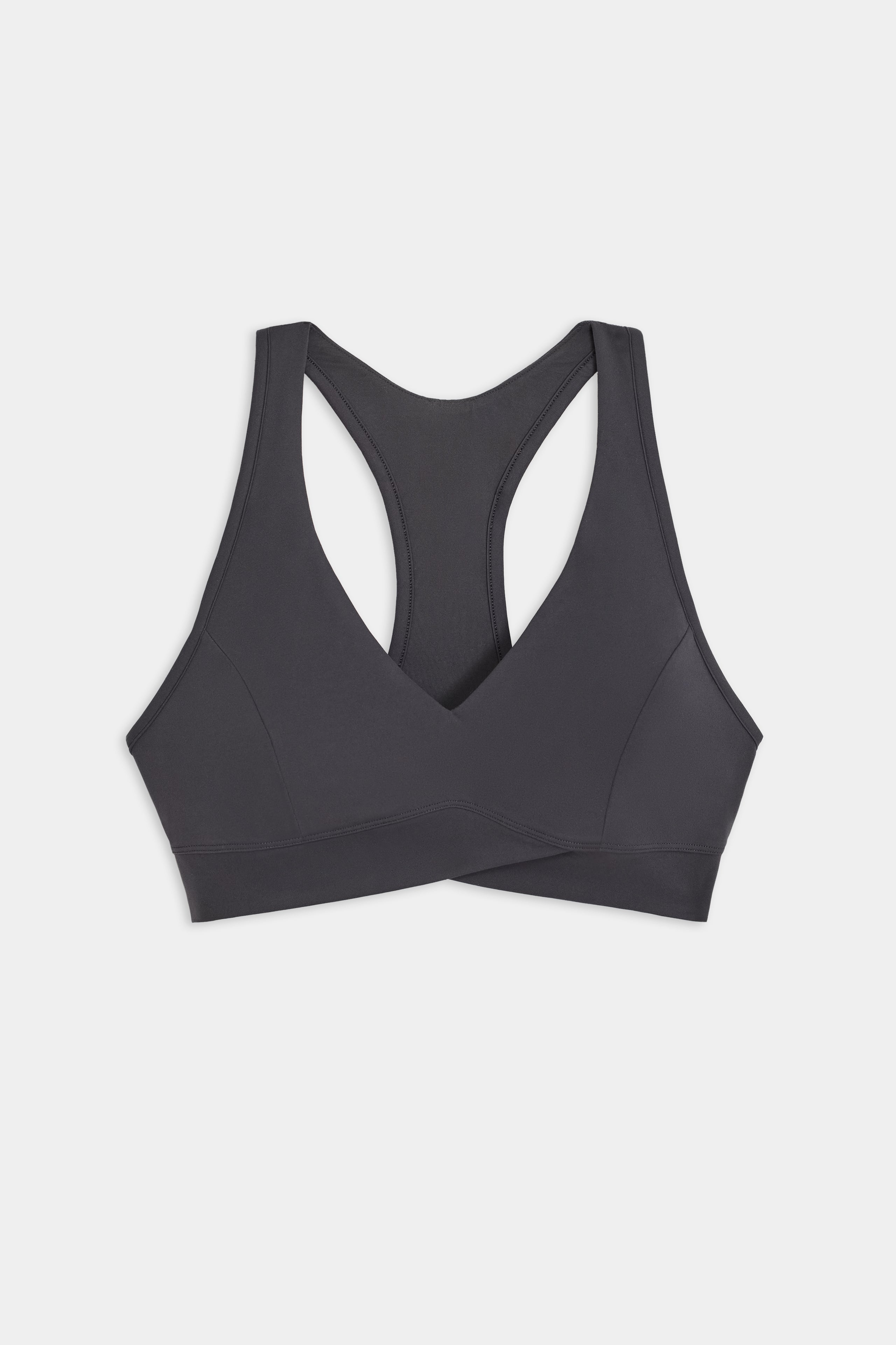 SPLITS59 Mia Rigor Bra in black features a racerback design, showcased on a white background.
