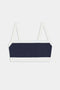 The SPLITS59 Monah Rigor Bra in Indigo/White features thin shoulder straps, ideal for gym workouts. Displayed on a white background, it highlights its sleek design perfect for any exercise routine.