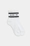 A pair of white Logo Stripe Quarter Socks by SPLITS59 with black branding on the cuffs.