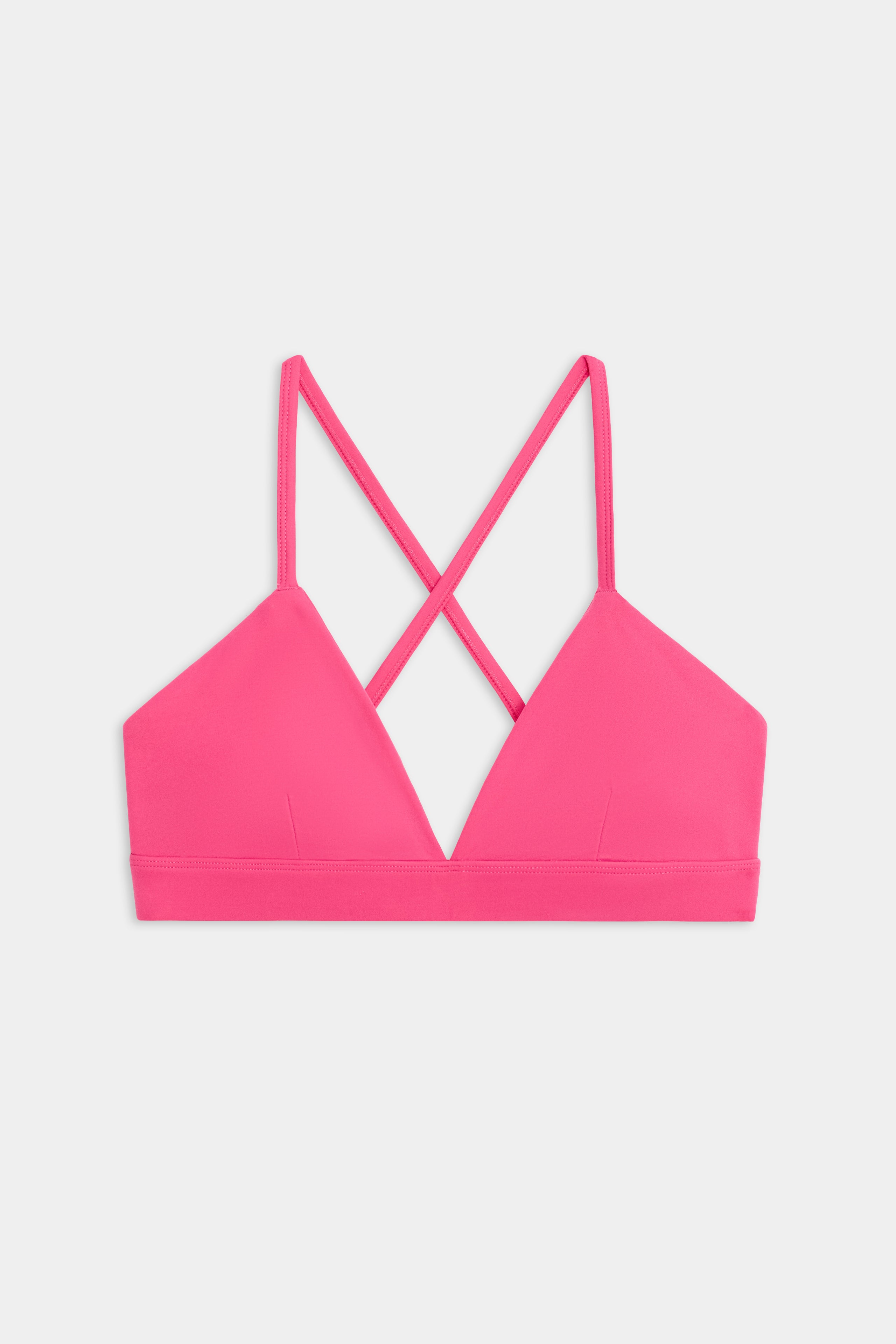 The SPLITS59 Theo Rigor Bra features triangle-shaped cups and crisscross straps in the back, shown on a plain white background.