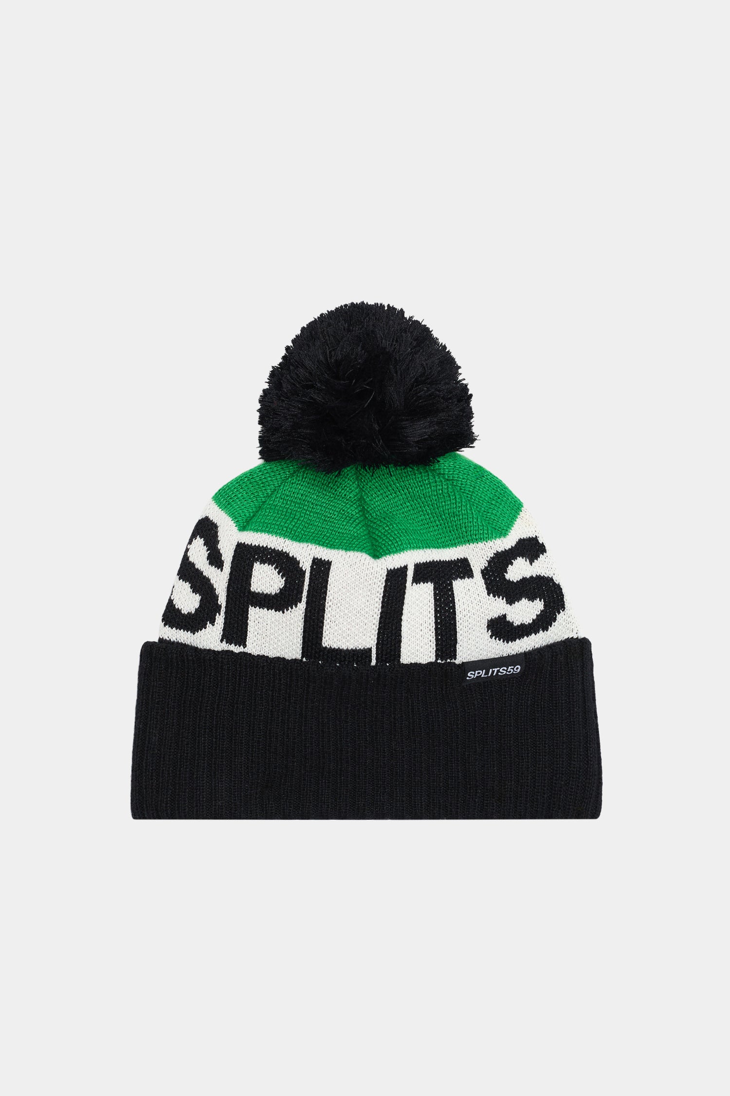 The SPLITS59 Winter Pom Pom Beanie - Black/Grass is made from 100% polyester, with a black pom-pom, green and white top, black lower section, and bold “SPLITS” lettering on the front.