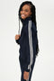 Woman smiling in a SPLITS59 Fox Techflex Jacket in Indigo/Vintage White with white stripes.