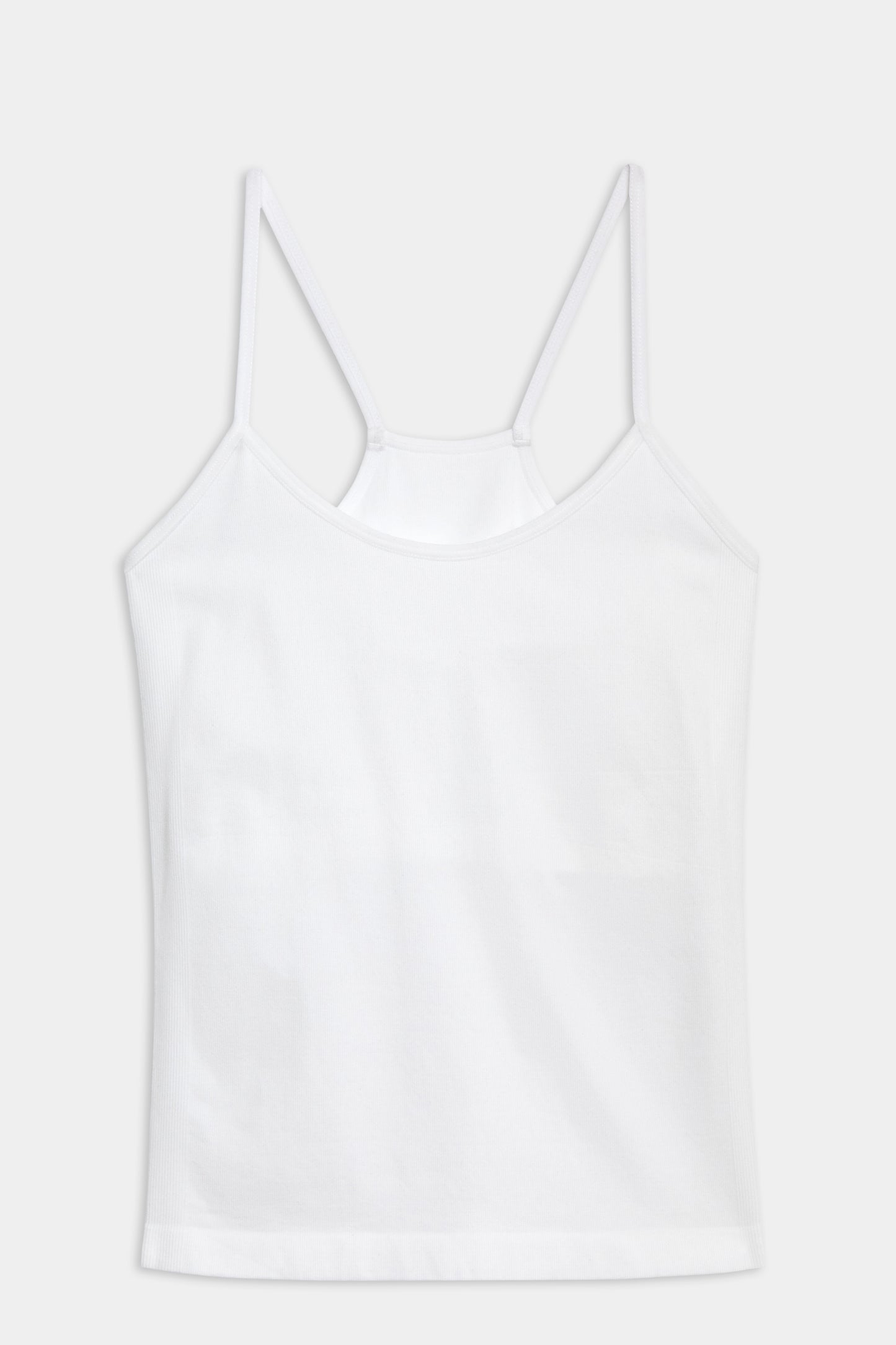 A SPLITS59 Loren Seamless Waist Length Tank - White with a shelf bra on a white background, perfect for gym workouts.