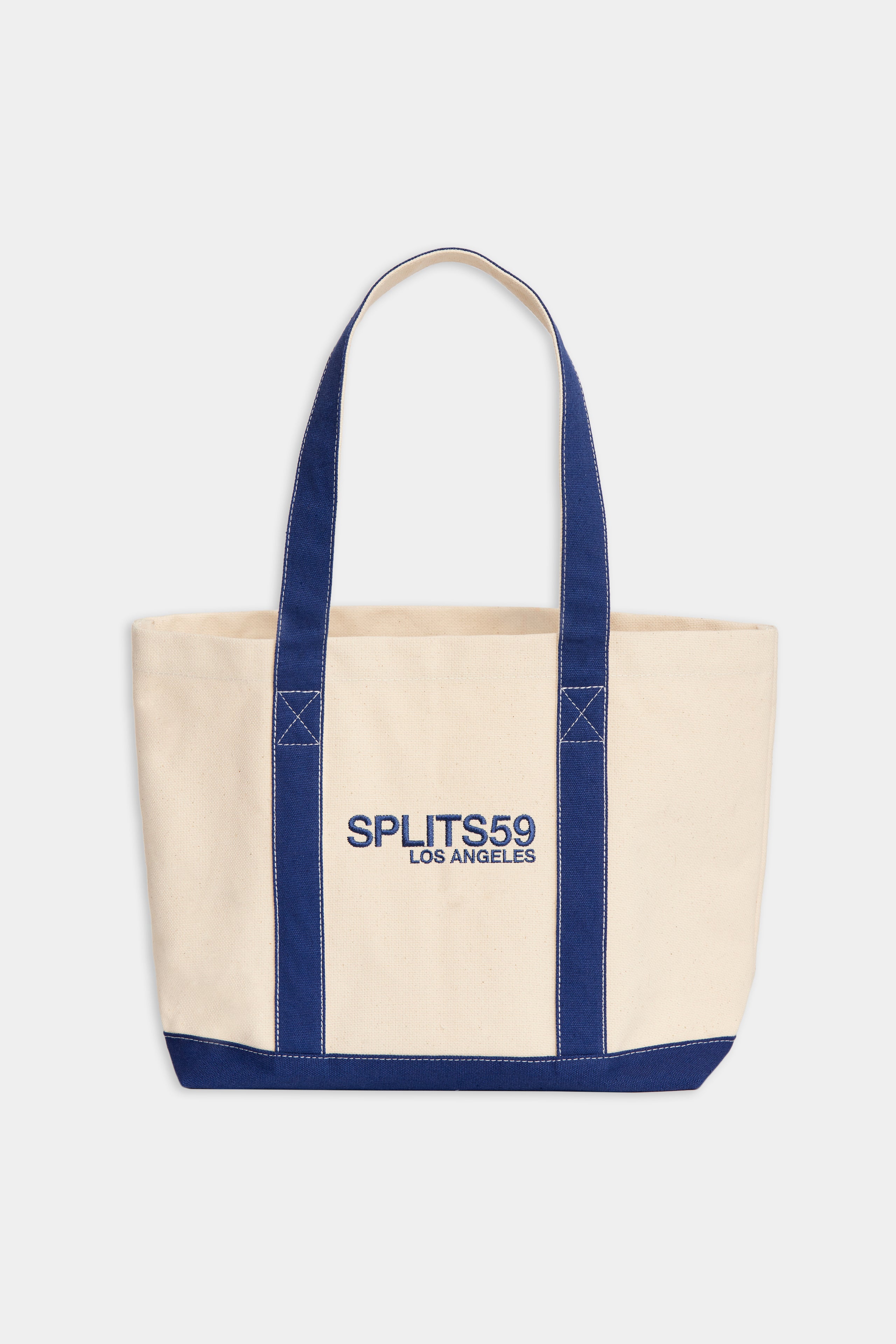 Beige heavyweight Canvas Tote Bag - White/Navy with reinforced blue handles and 'Tropic of C' branding on the front.